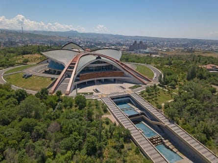 A modern conference building surrounded by trees. A modern conference building surrounded by trees.